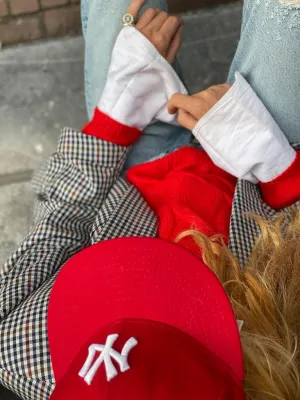 Bright red sweater by Luisa Cerano.